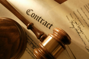 Business Litigation Lawyer Montana - Contract with gavel on it