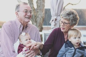Elderly couple play with grandkids before contacting an Estate Planning Lawyer Great Falls, MT
